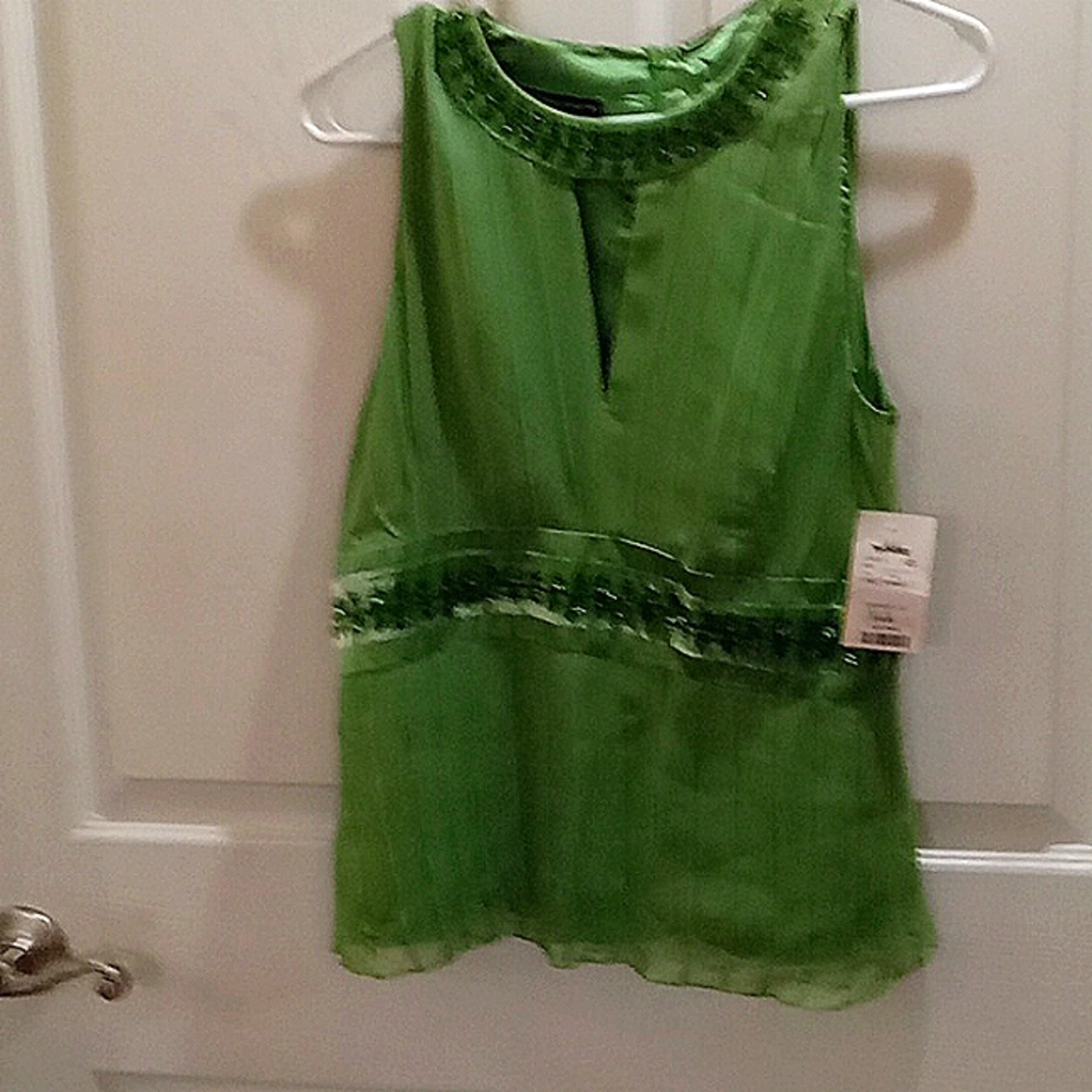 Emerald green tank style blouse.  It can be a party style or casual.